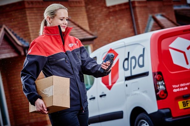 Dpd delivery driver woman smiling after completing another sucessfull delivery (Before 12:00 - UK nationwide)